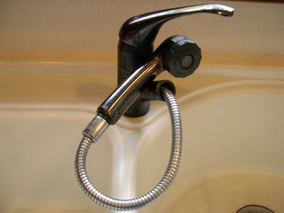 a pull-out kitchen faucet is perfect to supply warm water to a portable shower